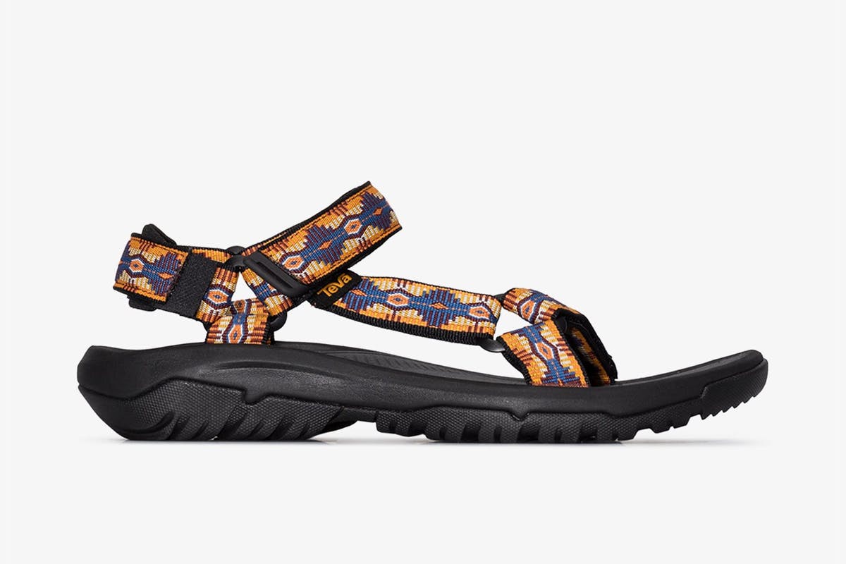 Side profile view of a brown Teva Hurricane XLT2 sandal