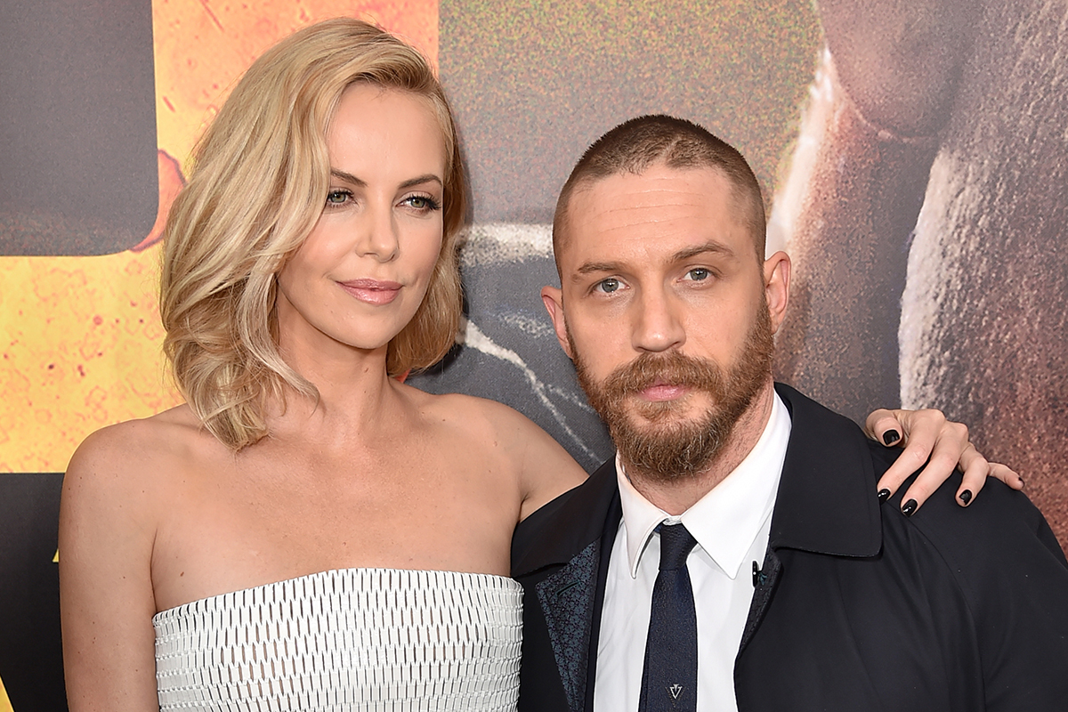Charlize Theron (L) and Tom Hardy attend the premiere of Warner Bros. Pictures' "Mad Max: Fury Road"