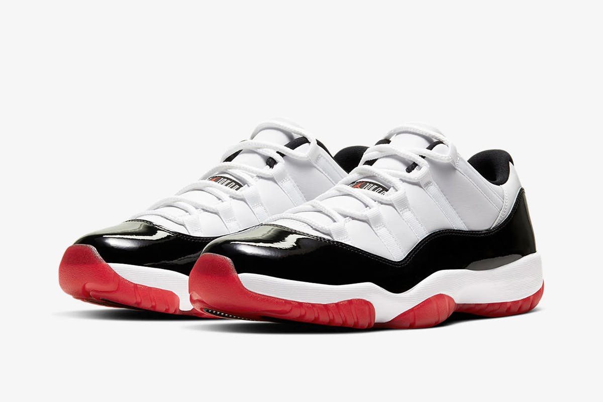 Product image of Nike Air Jordan 11 low in a black, white, and red colorway