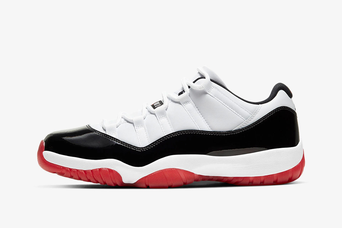 Product image of Nike Air Jordan 11 low in a black, white, and red colorway