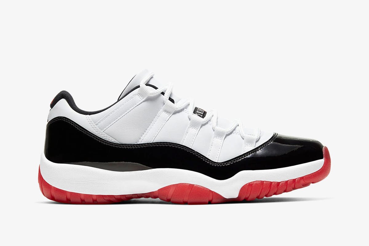 Product image of Nike Air Jordan 11 low in a black, white, and red colorway