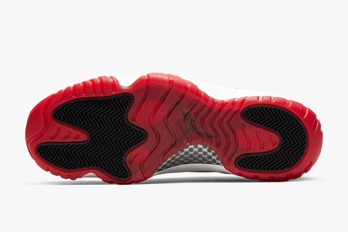 Product image of Nike Air Jordan 11 low in a black, white, and red colorway