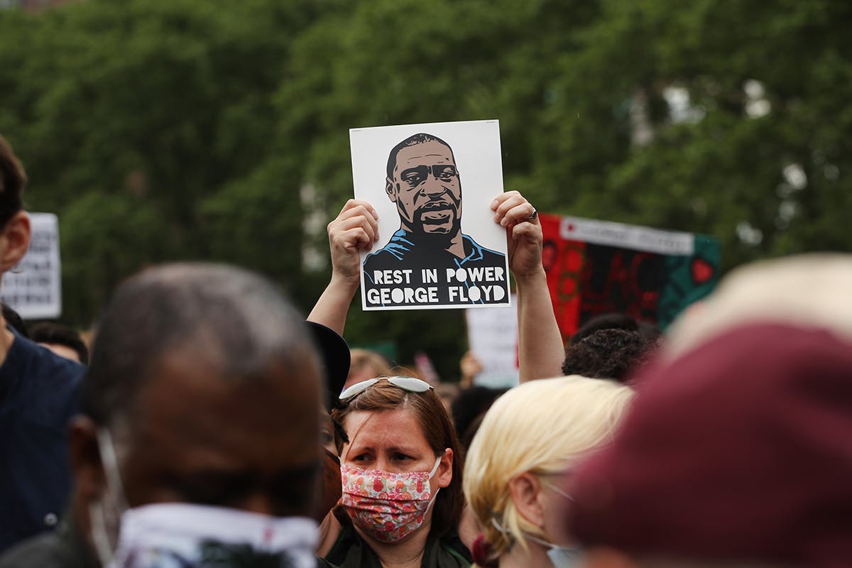 people gather in Brooklyn’s Cadman Plaza Park for a memorial service for George Floyd