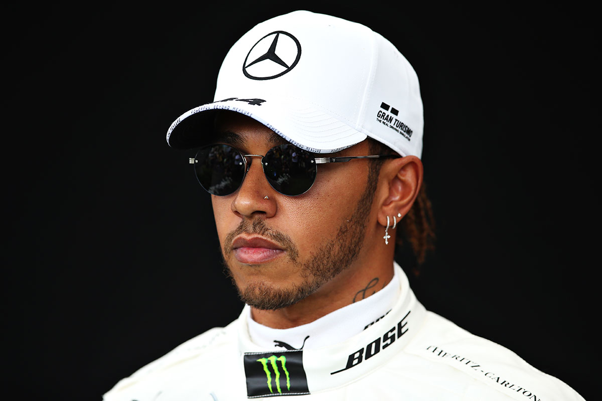 Lewis Hamilton of Great Britain and Mercedes GP poses for a photo in the Paddock