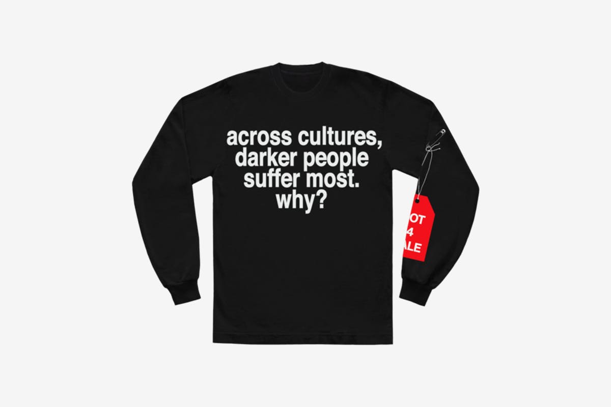 image of Andre' 3000's new sweater with slogan from tour jumpsuits