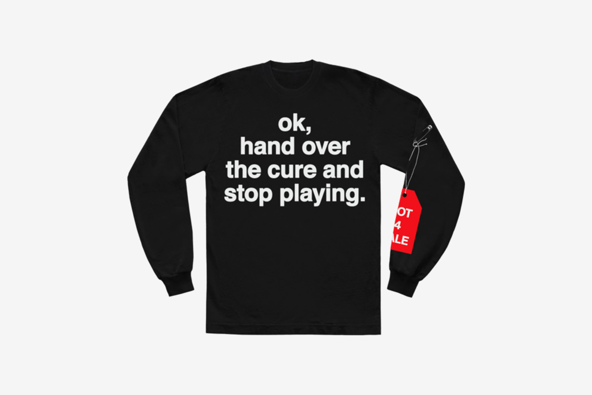 image of Andre' 3000's new sweater with slogan from tour jumpsuits