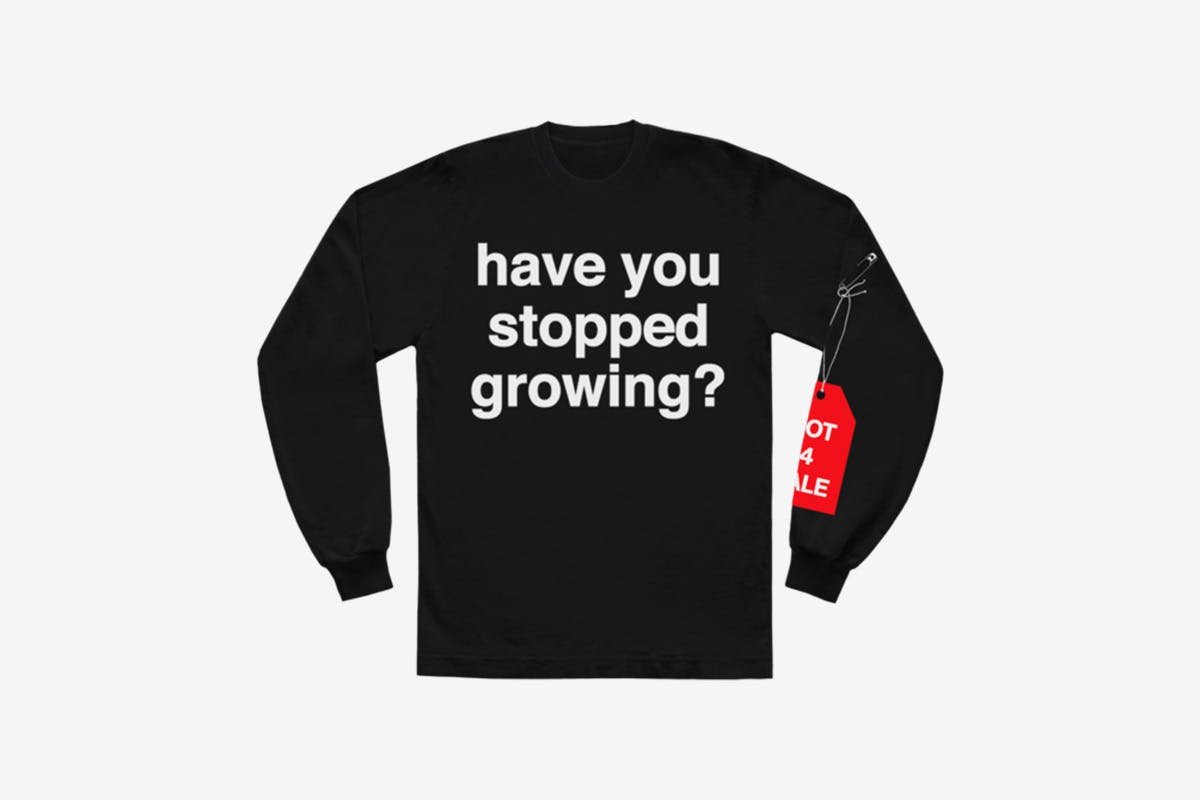 image of Andre' 3000's new sweater with slogan from tour jumpsuits