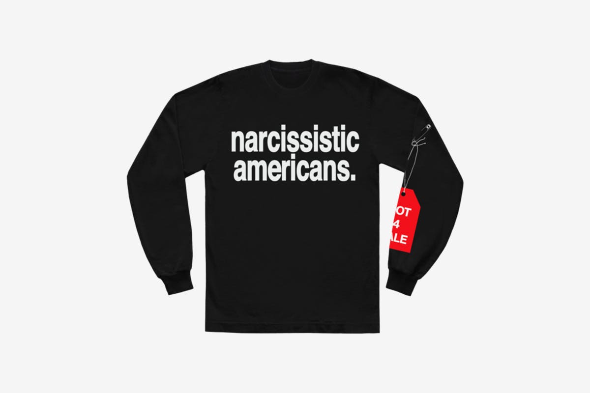 image of Andre' 3000's new sweater with slogan from tour jumpsuits