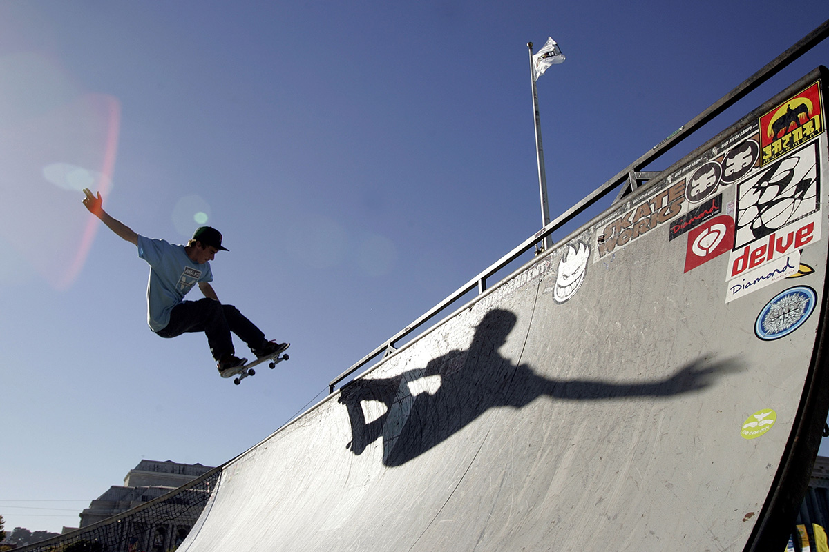 A skateboarder rides a ramp outside the World Cyber Games