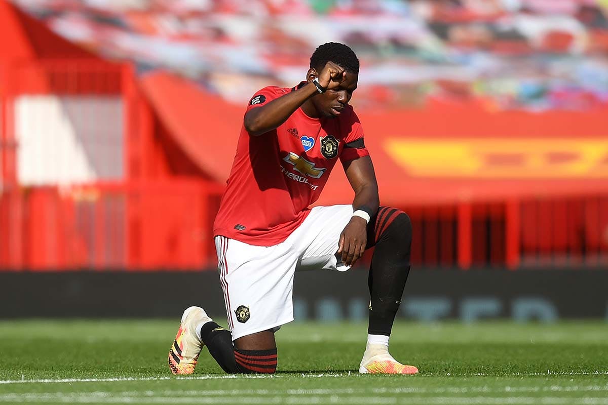 Paul Pogba of Manchester United takes a knee in support of the Black Lives Matter movement