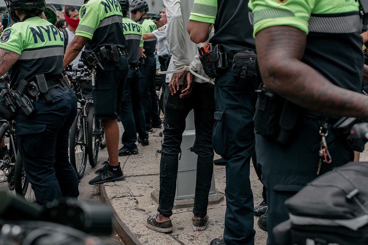 A protester is arrested by NYPD officers during a march against police brutality