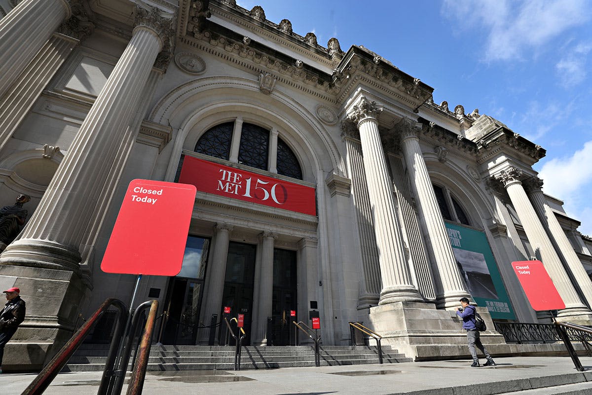 A closed sign is seen outside of The Metropolitan Museum of Art