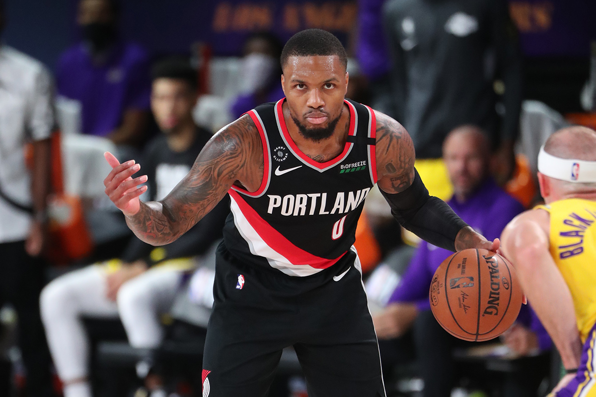 Damian Lillard #0 of the Portland Trail Blazers handles the ball against the Los Angeles Lakers during Round One, Game One of the NBA Playoffs