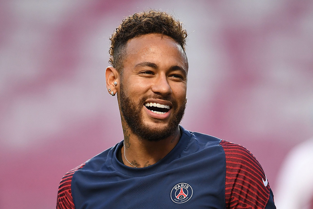 Paris Saint-Germain's Brazilian forward Neymar laughs during a training session at the Luz stadium in Lisbon