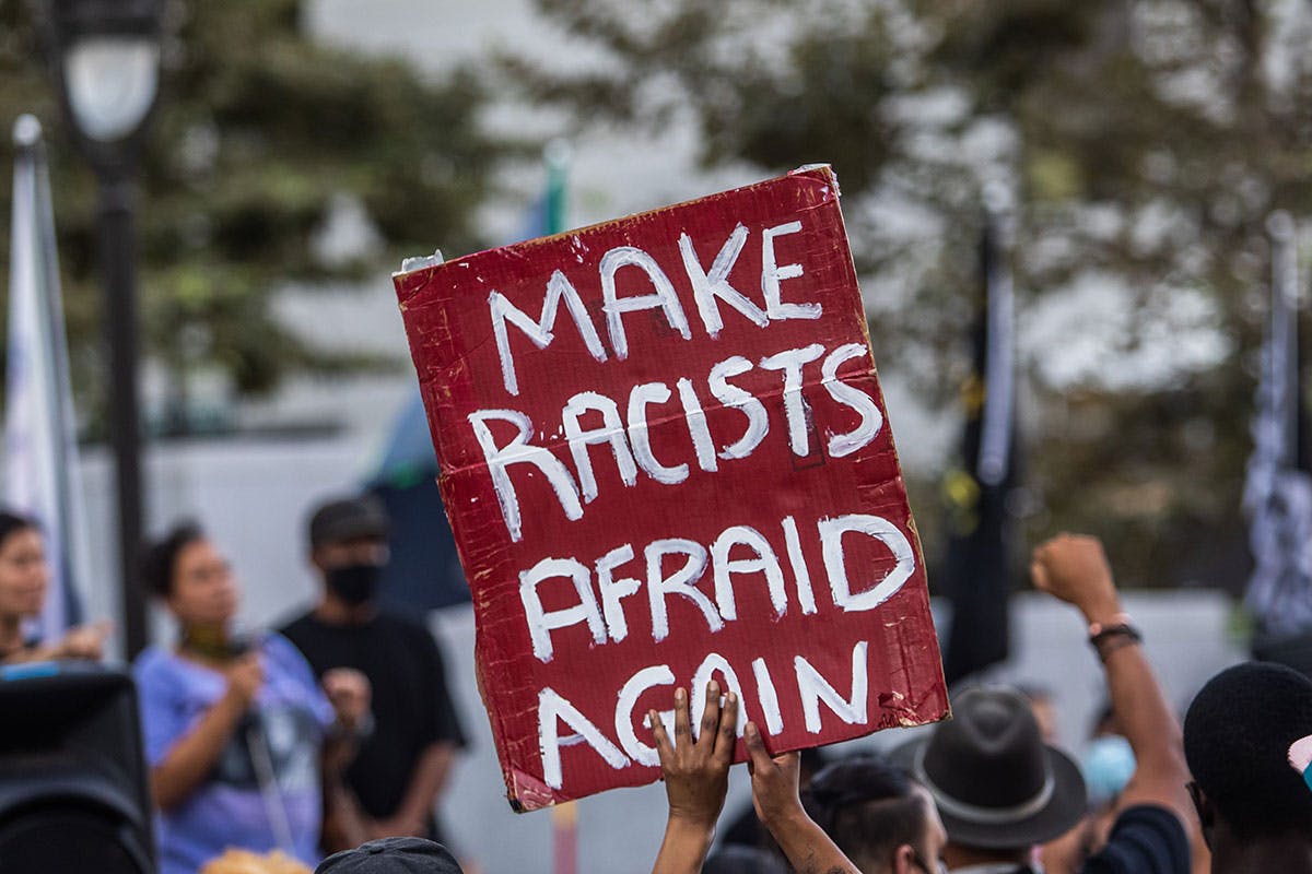 BLM protestor banner