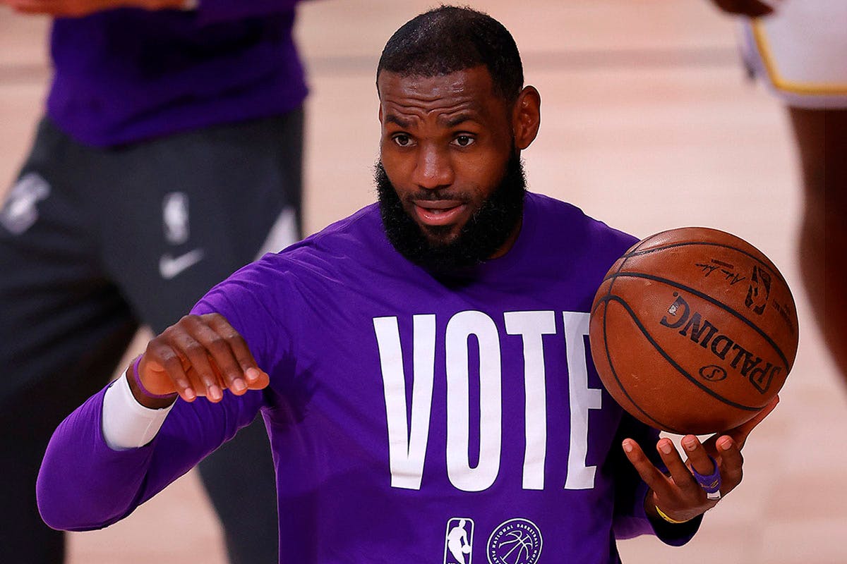 LeBron James #23 of the Los Angeles Lakers wears a VOTE shirt during warm-up