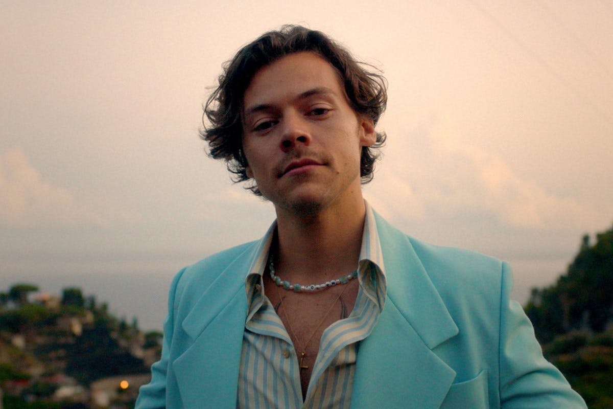 harry styles wearing blue suit in sunset