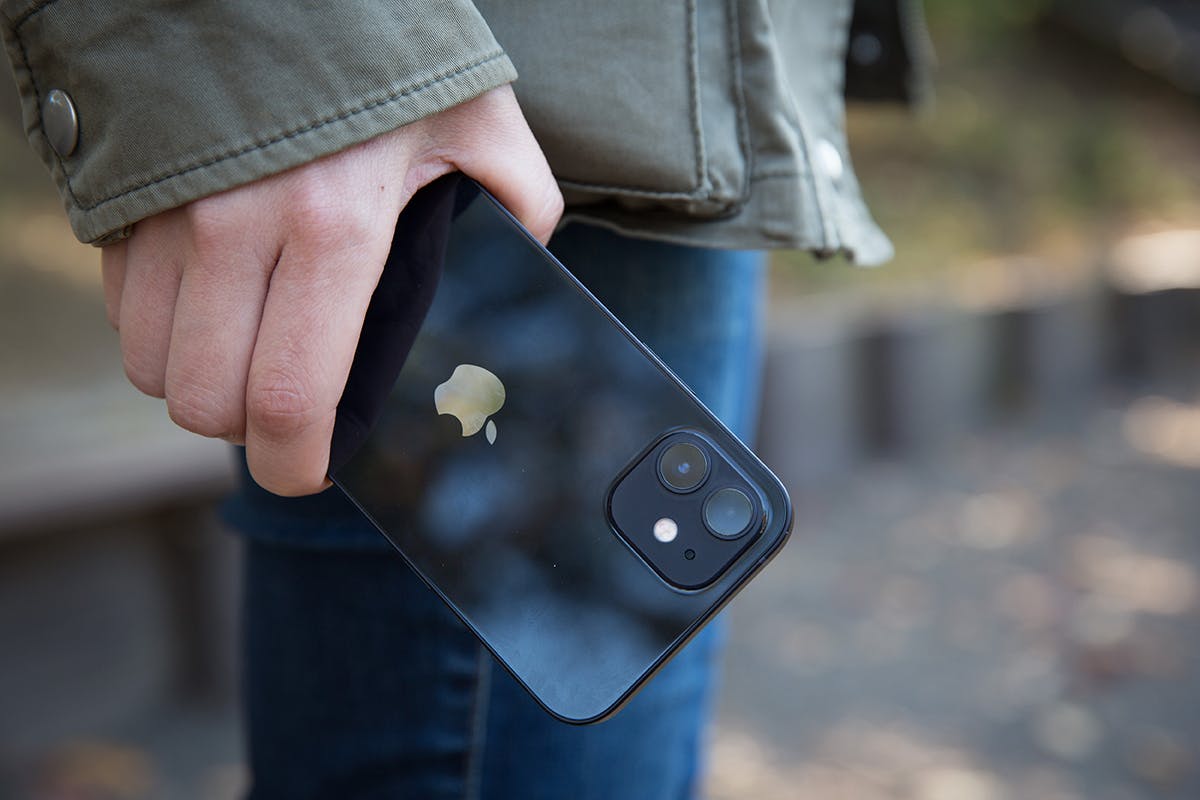 iPhone 12 in hand