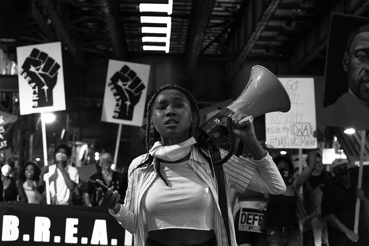 Woman holding loudspeaker