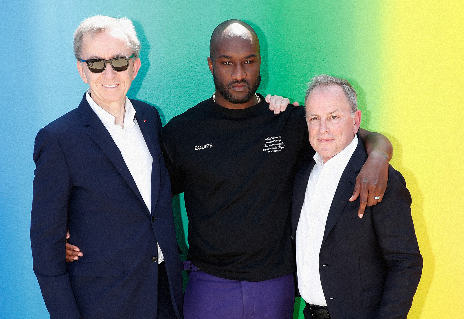 virgil abloh, Bernard Arnault and Michael Burke posing together with colorful background lvmh off-white
