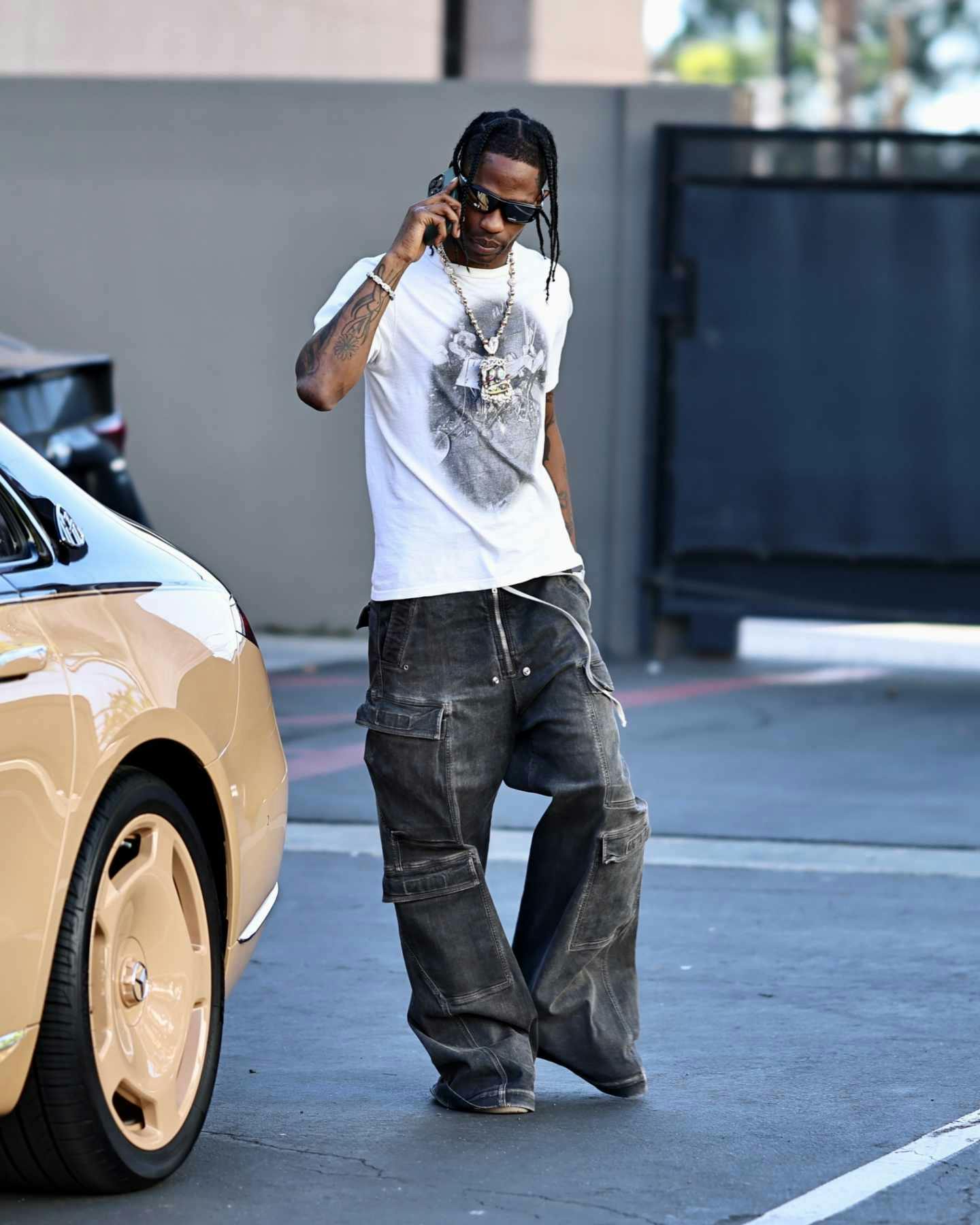 Travis Scott Wears Pharrell's Louis Vuitton With Air Jordan 1s