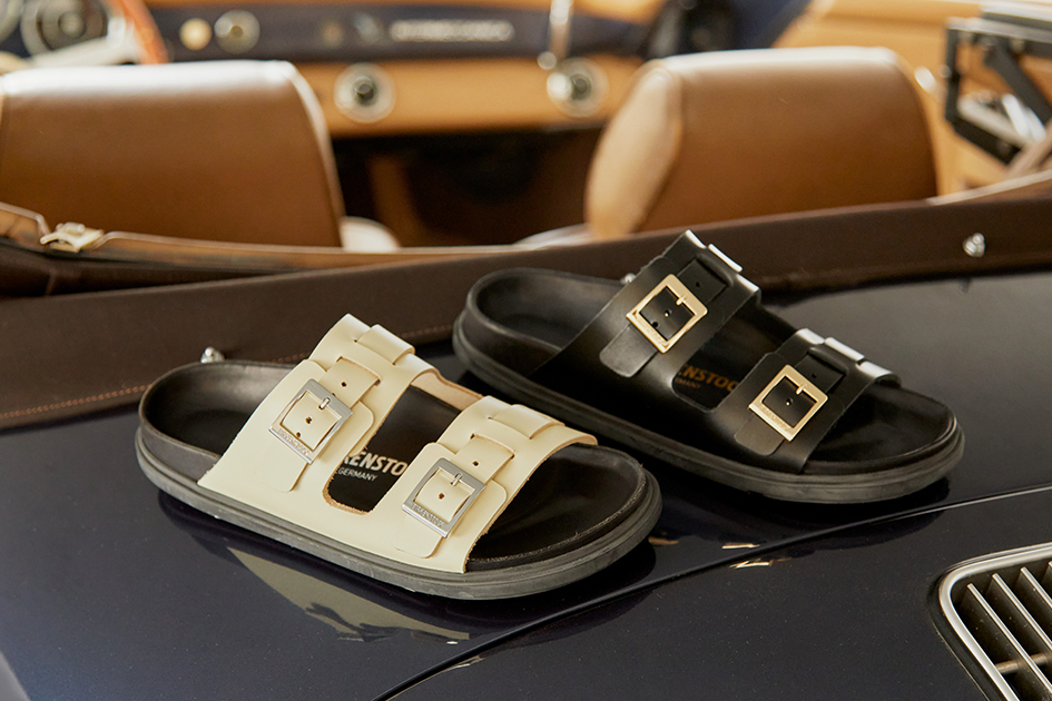 Two pairs of Birkenstock's St. Barths sandal in black and white leather colorways
