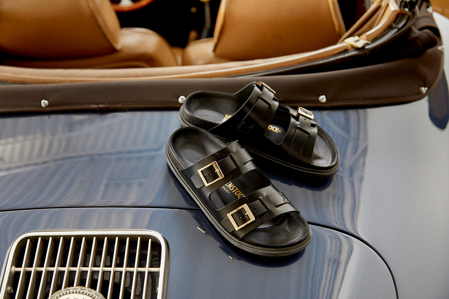Birkenstock's St. Barths sandal in a black leather color with two straps, silver buckles, and a black footbed