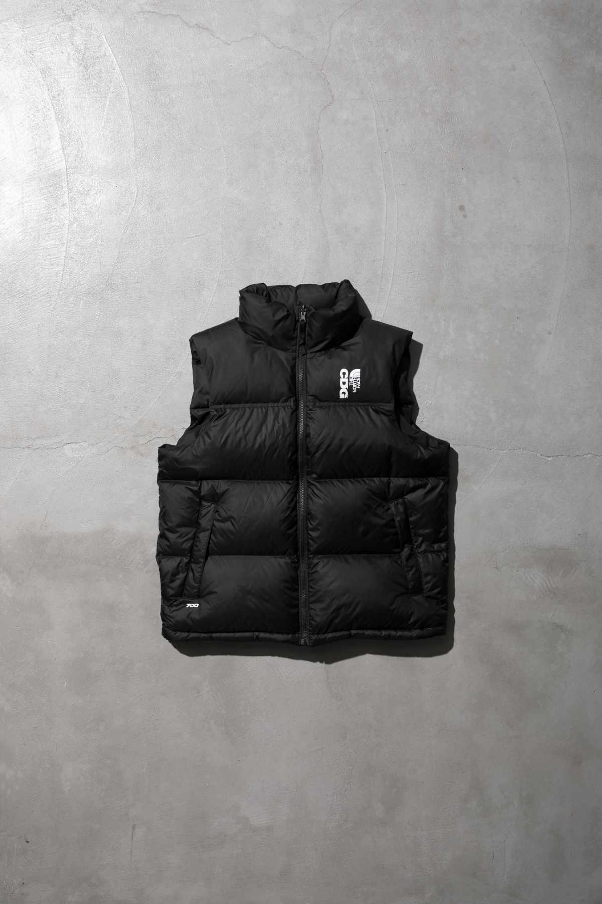 The CDG x TNF puffer vest collaboration