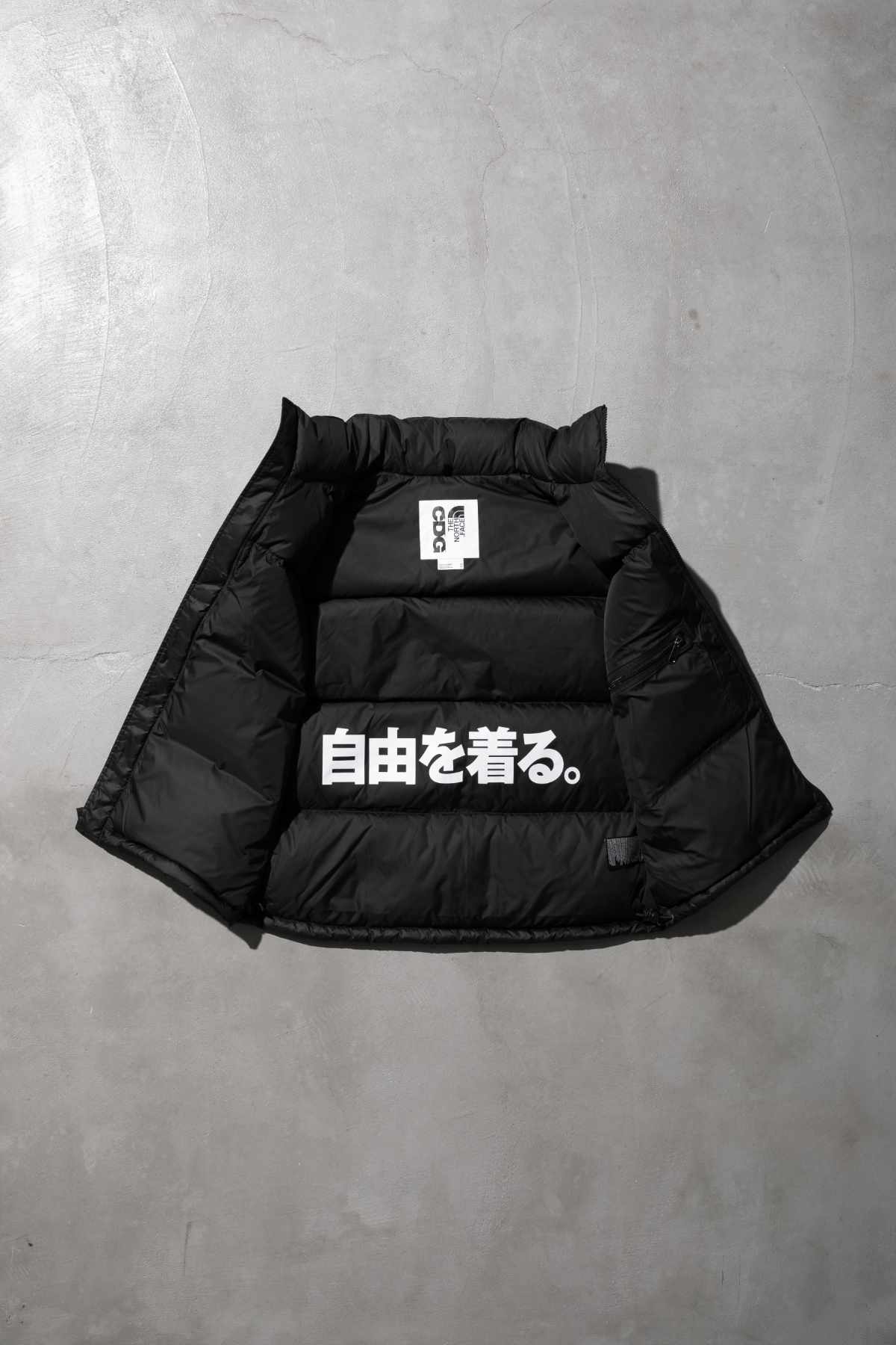 The CDG x TNF puffer vest collaboration
