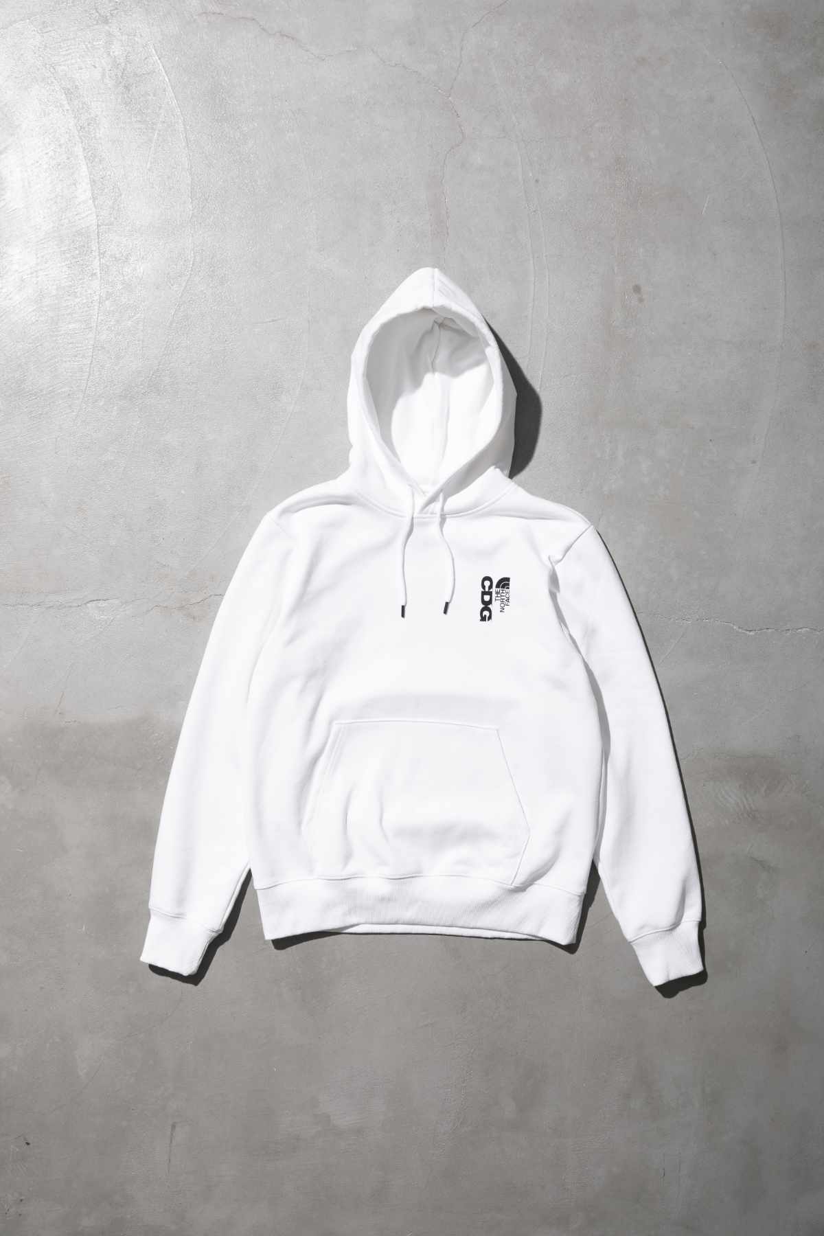 The CDG x TNF collab's white hoodie