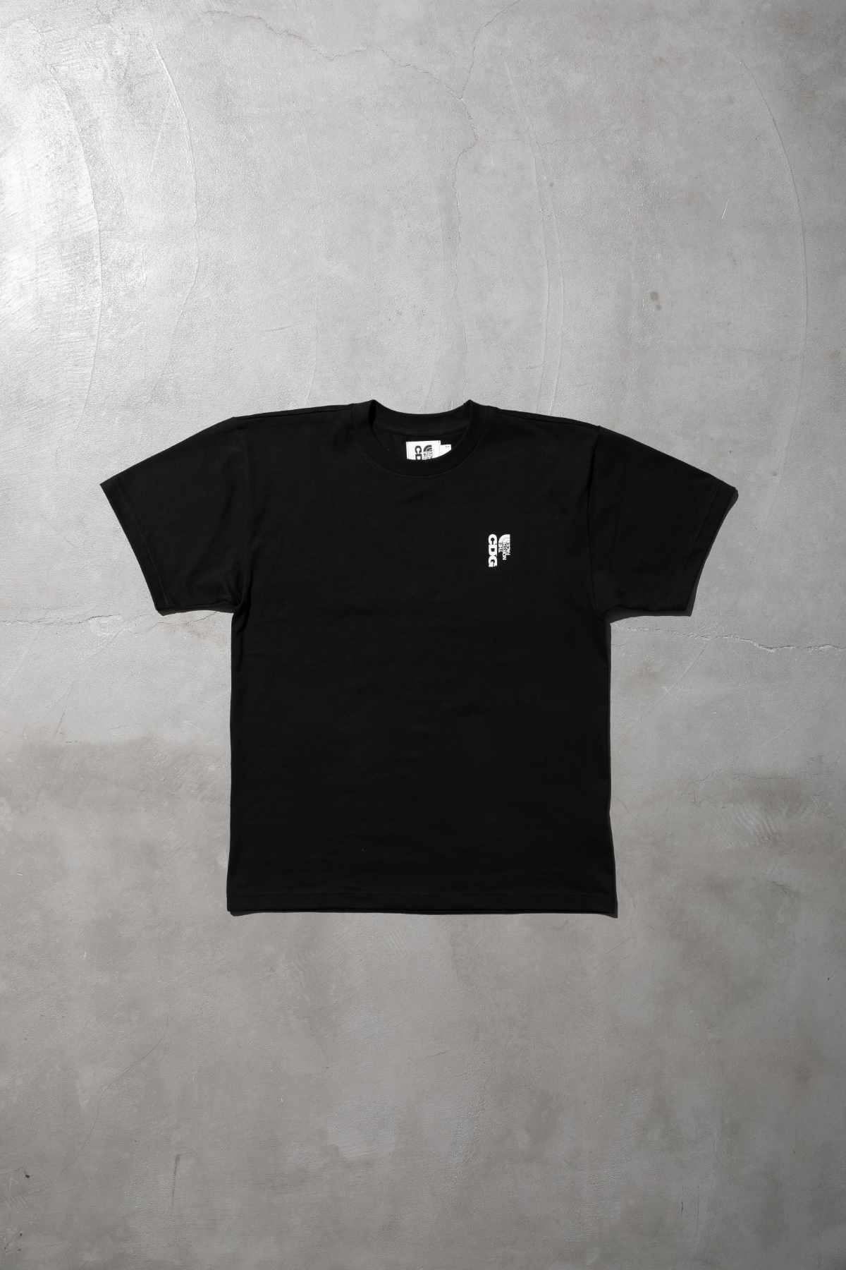 The CDG x TNF collab's black T-shirt