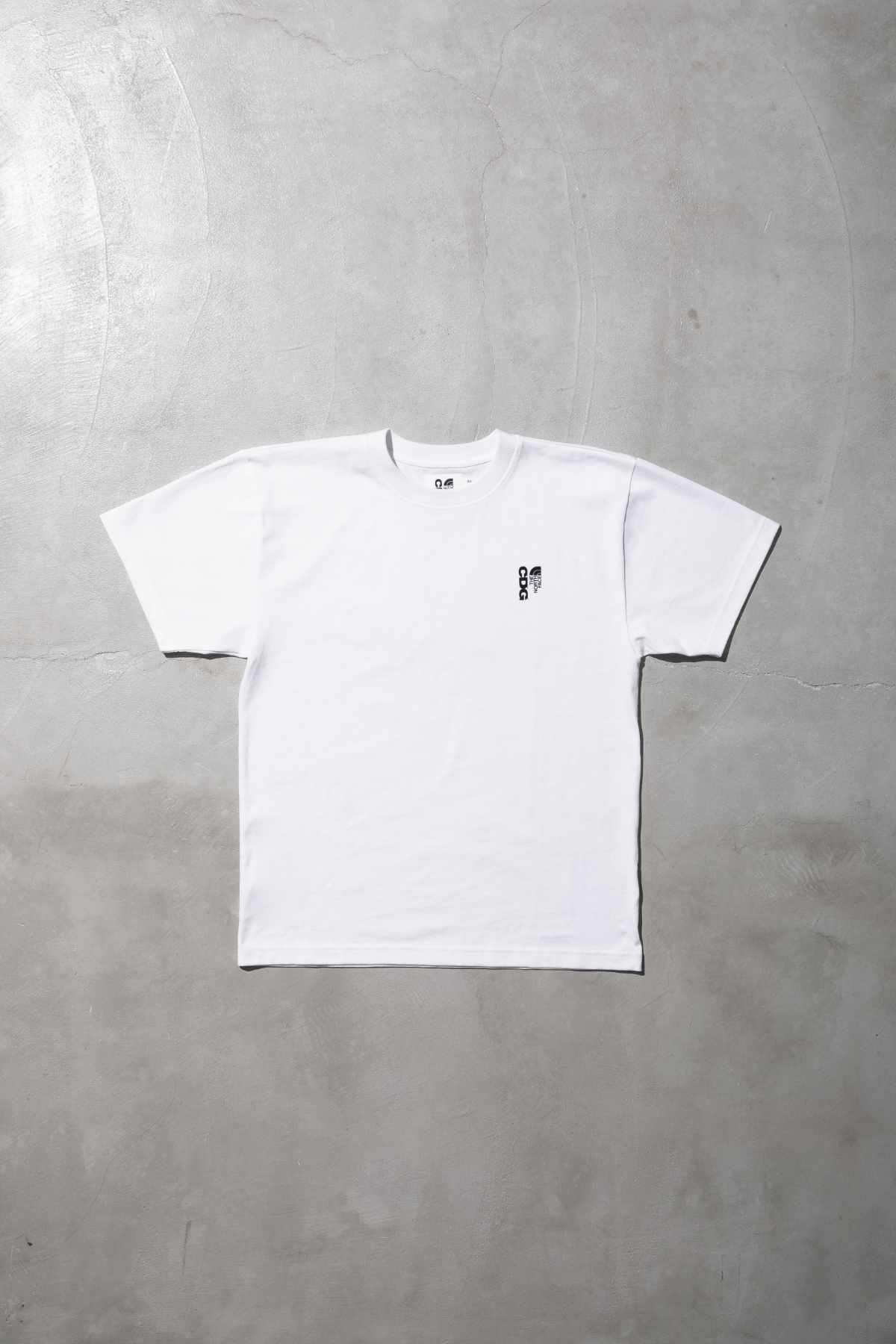 The CDG x TNF collab's white T-shirt