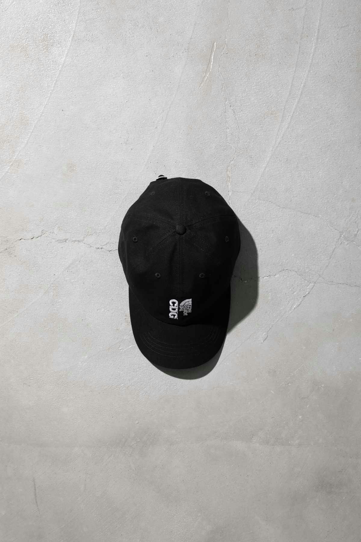 The CDG x TNF collab's black hat