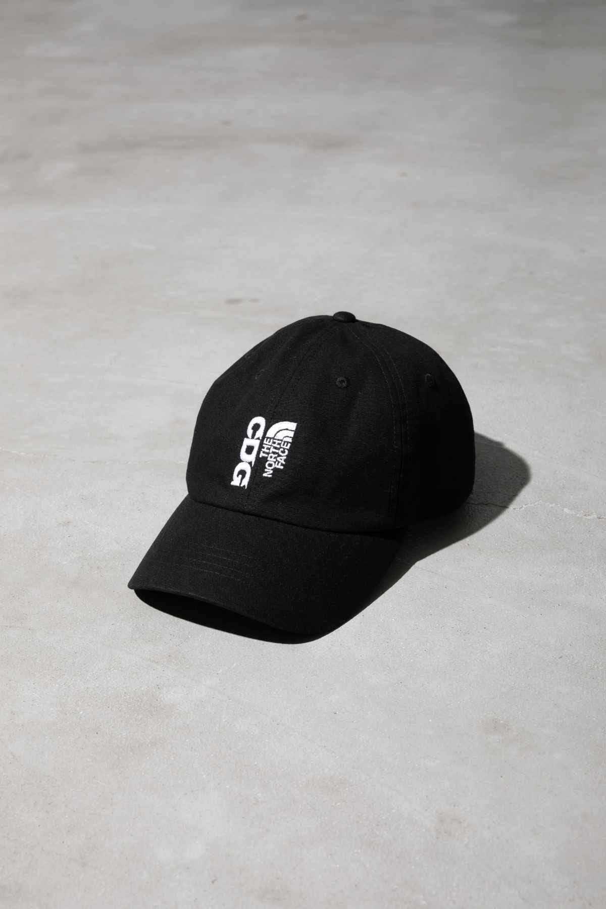 The CDG x TNF collab's black hat
