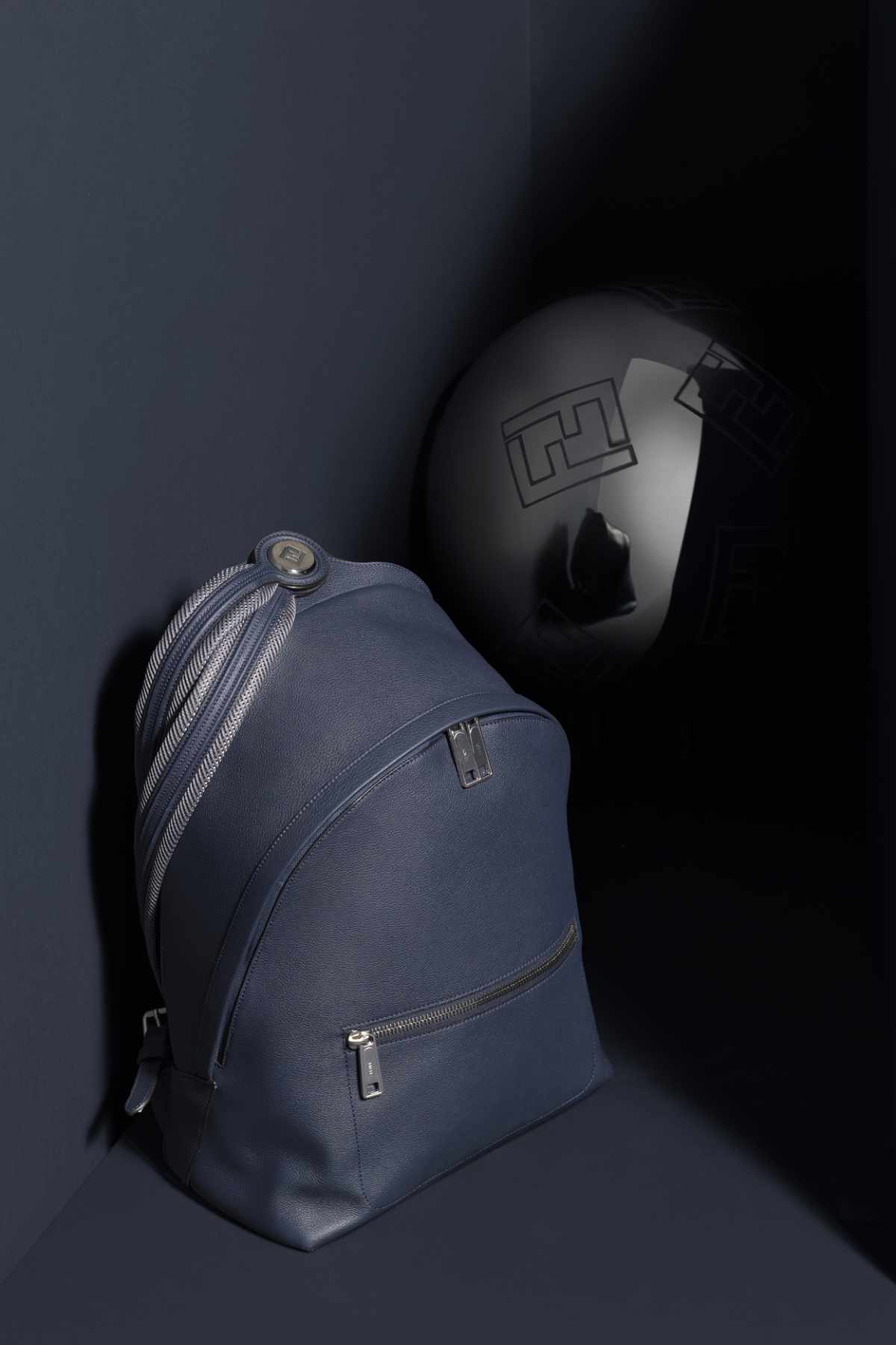 A lifestyle photo of Fendi's Chiodo backpack in navy leather