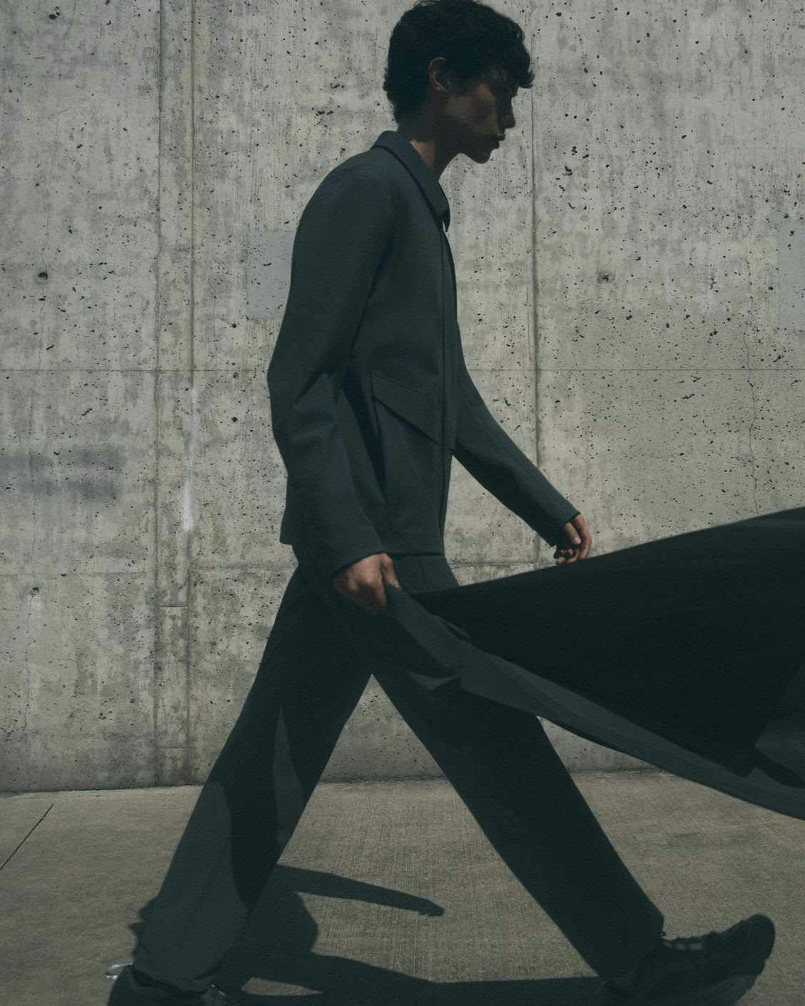 A model wears Veilance Fall 2023's waterproof grey suit