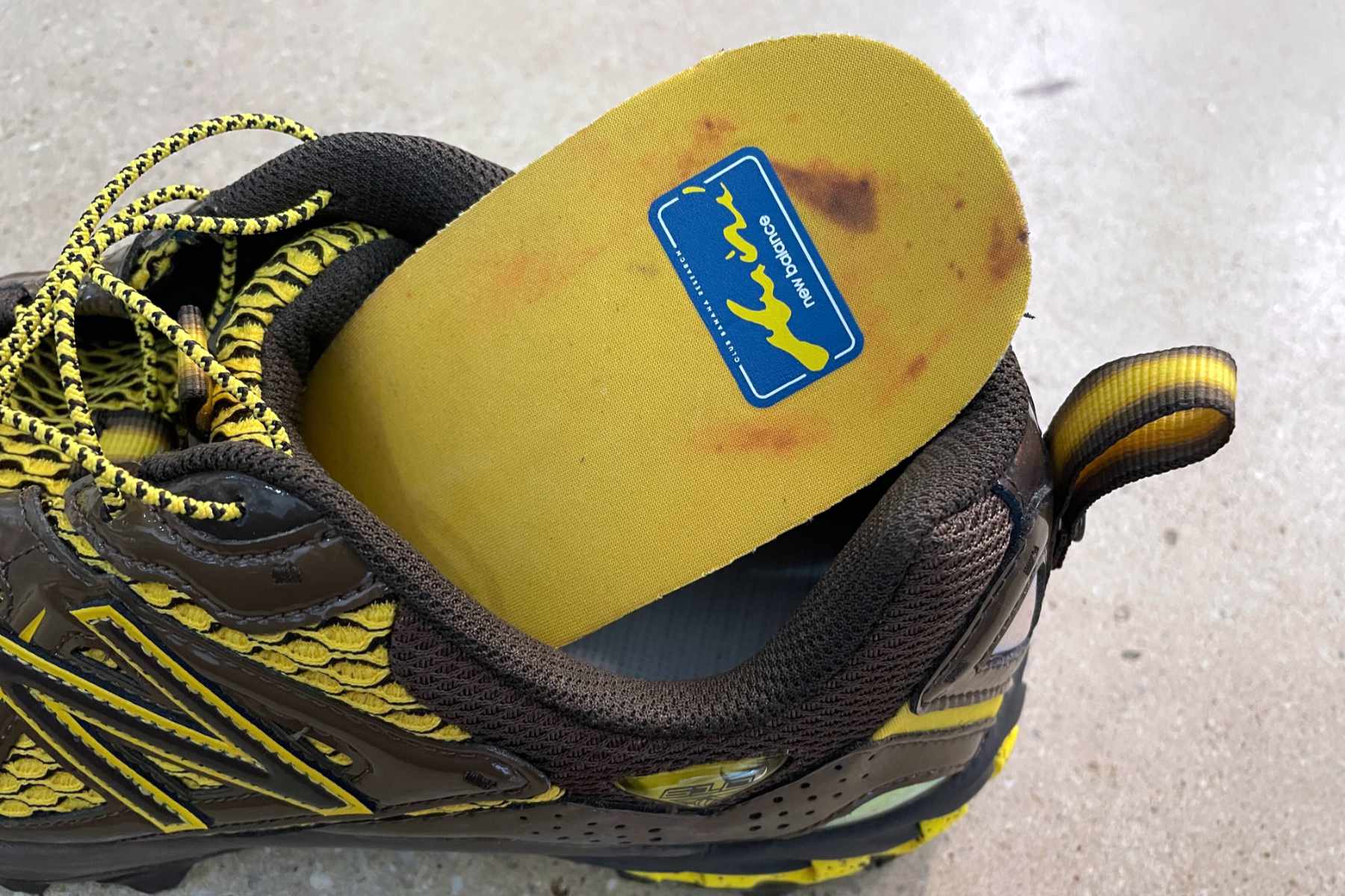 Amine's New Balance 610 shoe, "The Mooz," in brown and yellow colors with a banana-themed insole