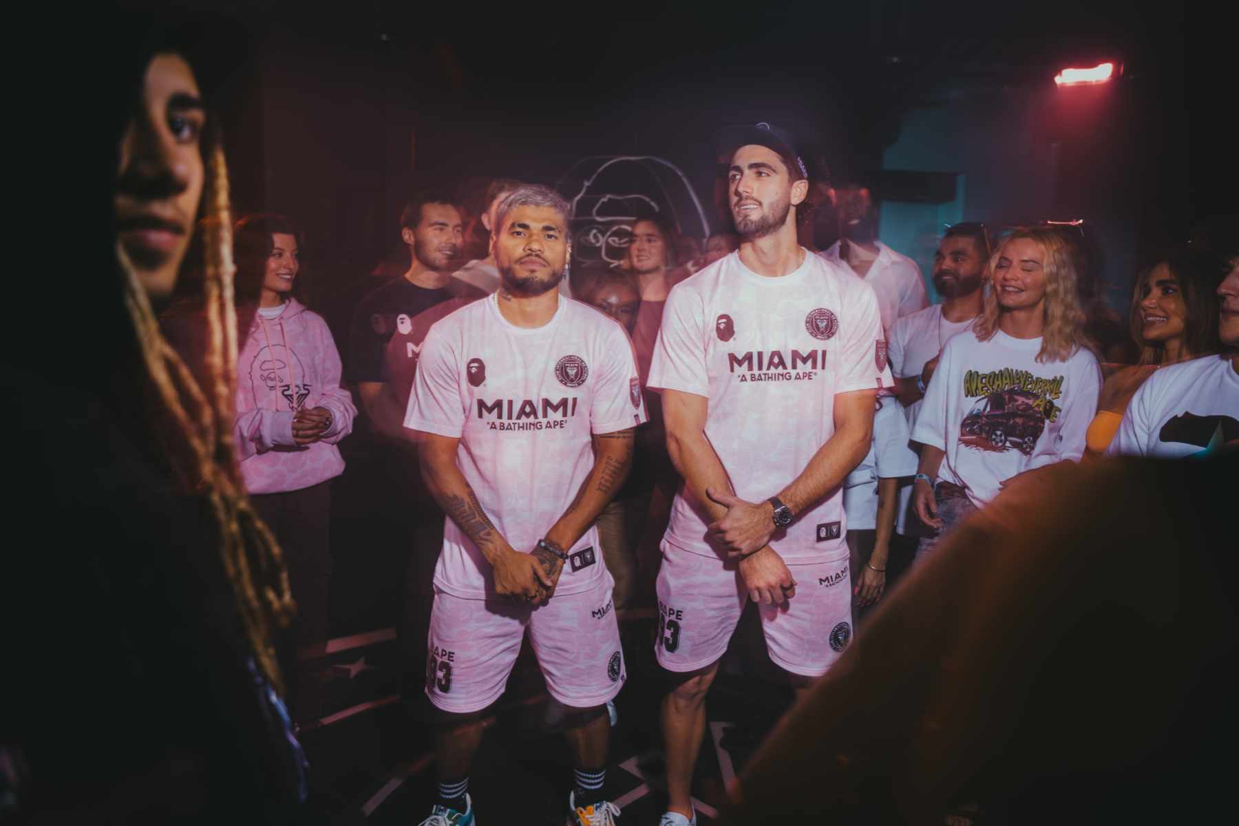 Two football players wear BAPE & Inter Miami's collaborative jersey