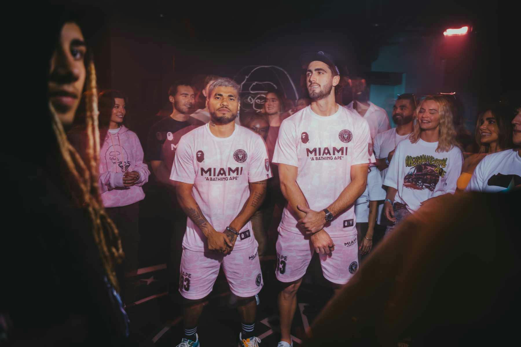 Two football players wear BAPE & Inter Miami's collaborative jersey