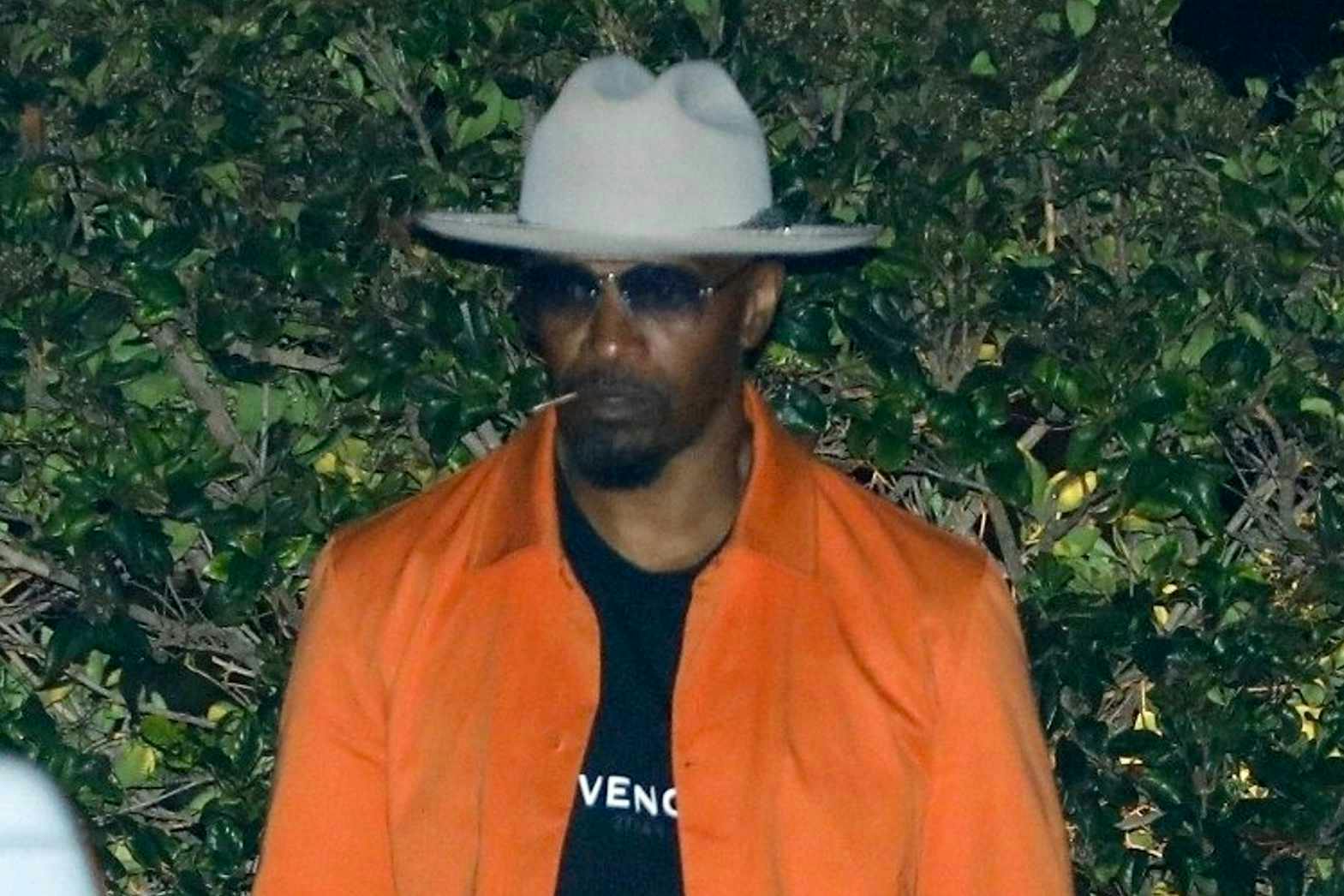 Jamie Foxx is seen on August 20 looking healthy wearing a Givenchy T-shirt, Amiri sweatpants & Versace sneakers
