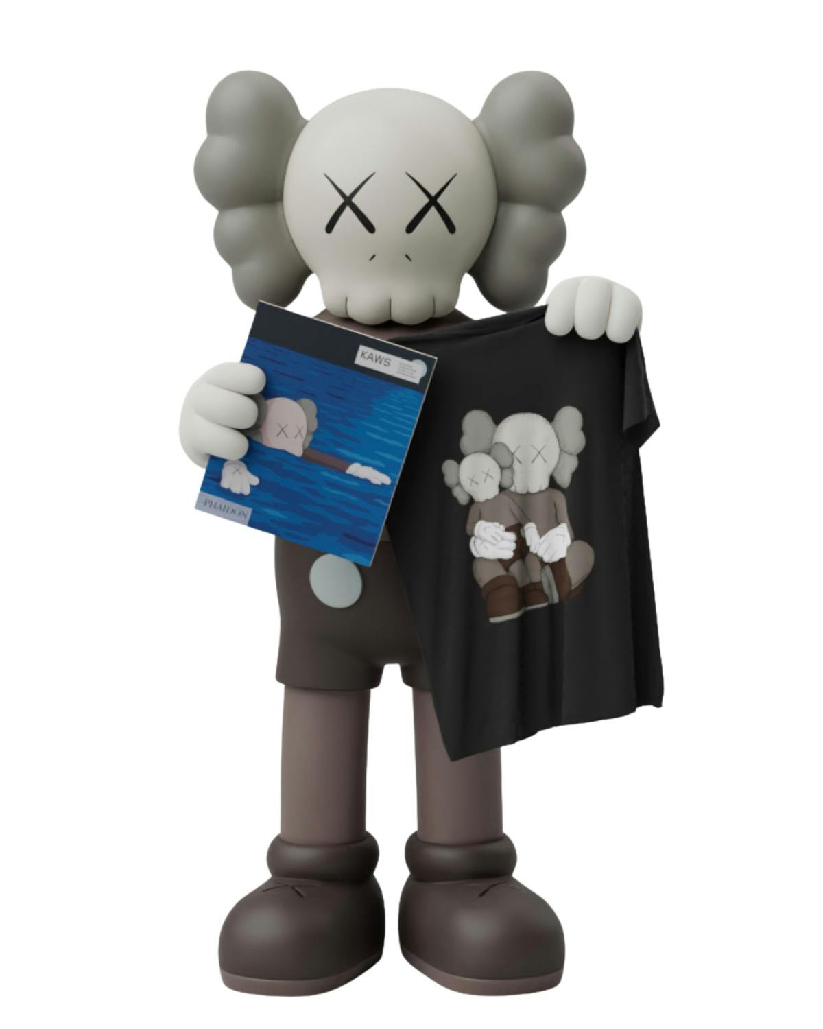 A KAWS Companion holds a UNIQLO x KAWS T-shirt and book