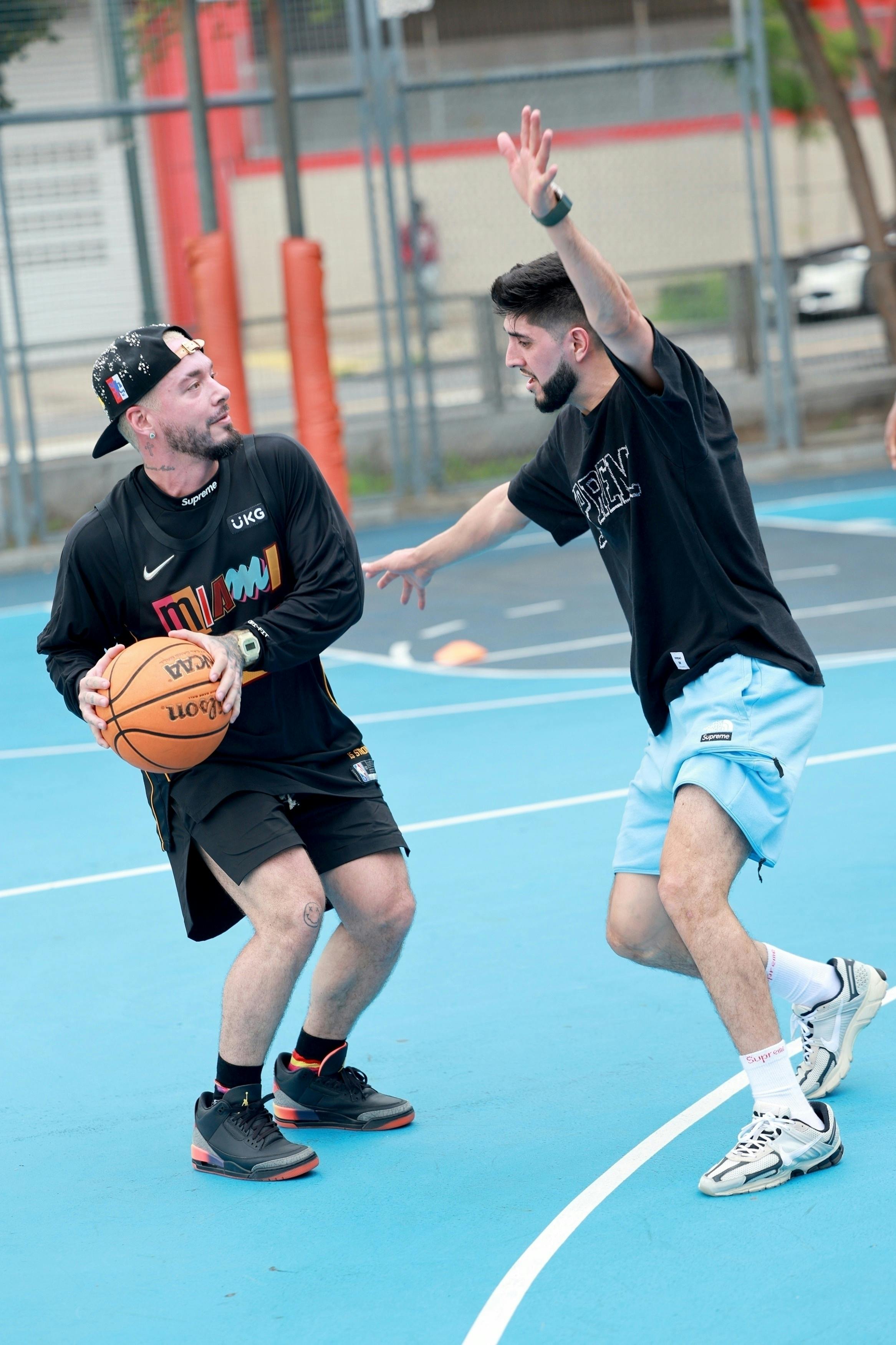 J.Balvin wears his unreleased Air Jordan 3 "Rio" shoes while playing basketball in New York with Jimmy Butler