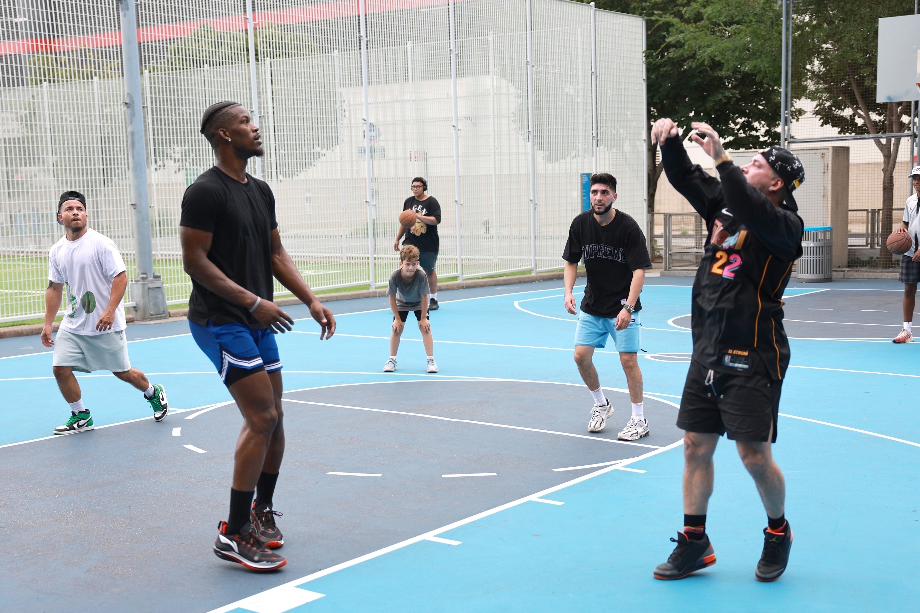 J.Balvin wears his unreleased Air Jordan 3 "Rio" shoes while playing basketball in New York with Jimmy Butler