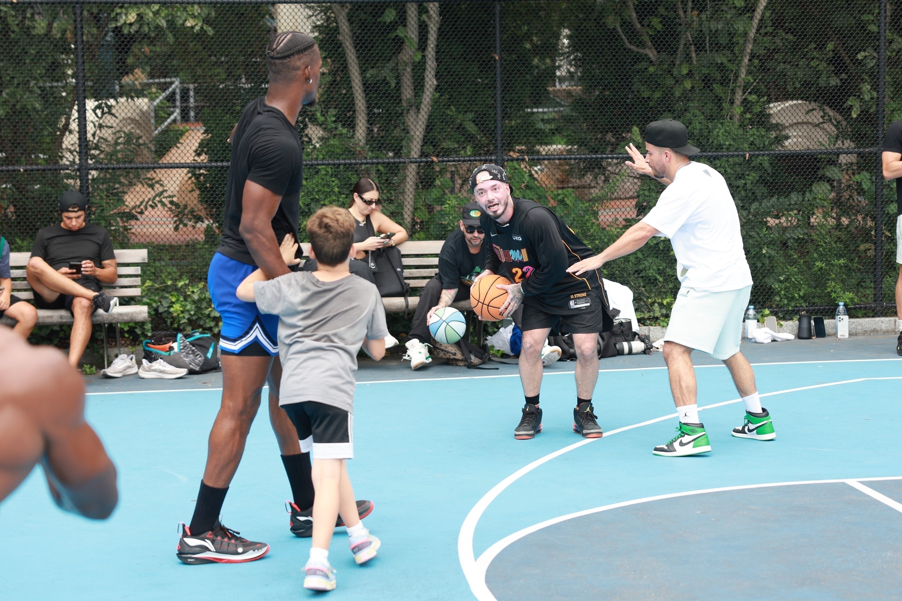 J.Balvin wears his unreleased Air Jordan 3 "Rio" shoes while playing basketball in New York with Jimmy Butler