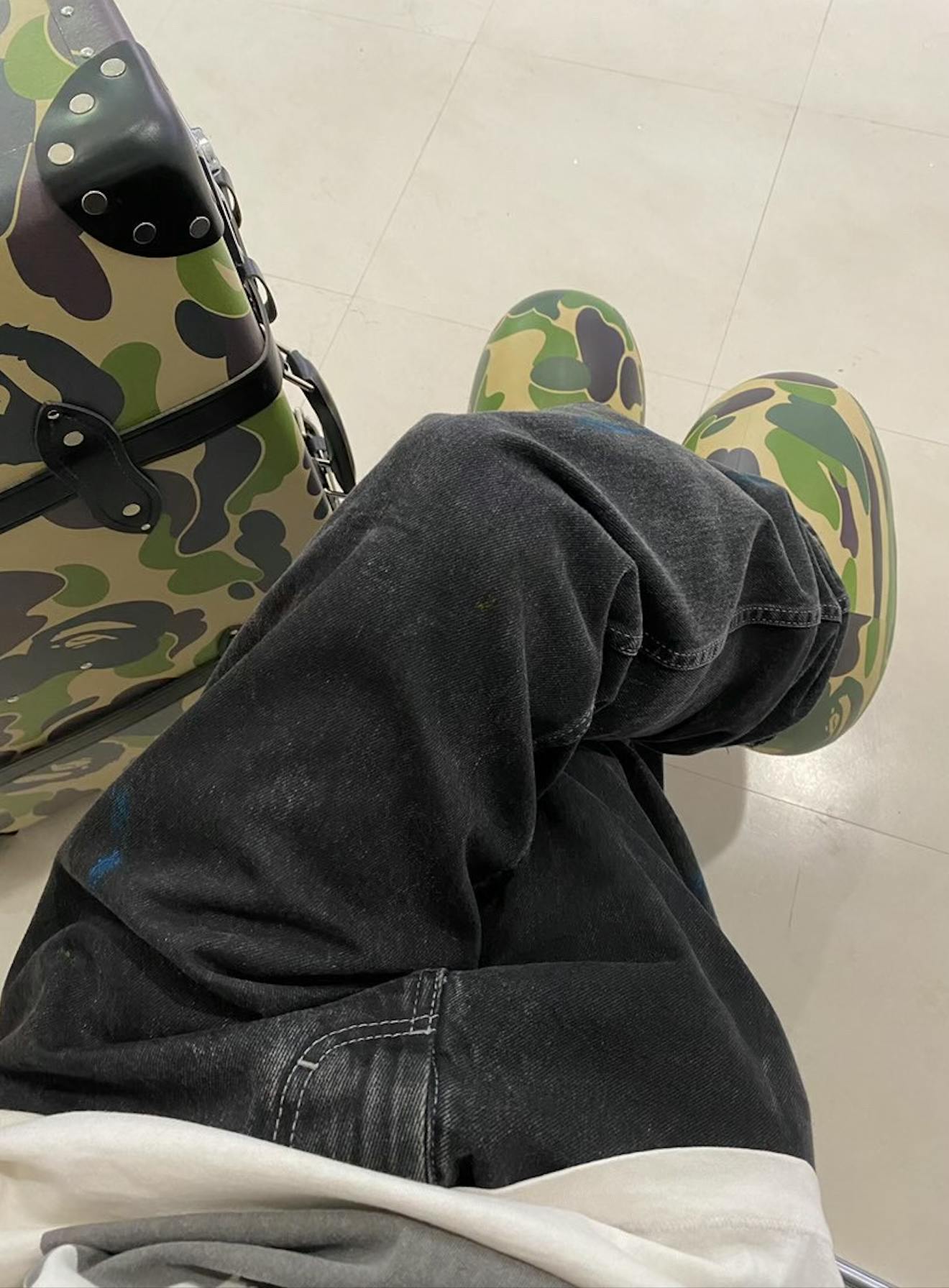 BAPE & MSCHF's pink and green camo-covered Big Red Boot, seen worn by models during the Tokyo Fashion Week runway show