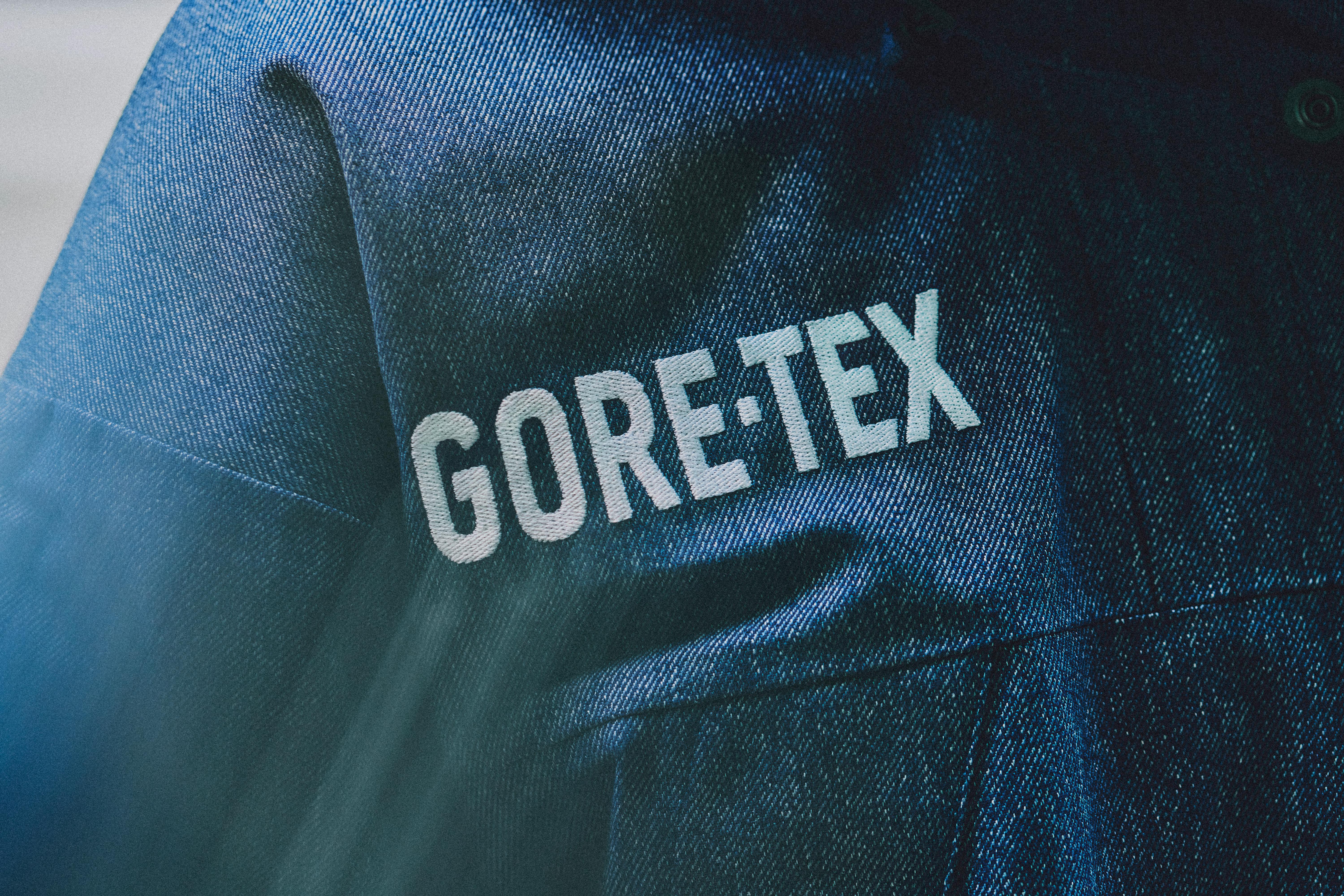 Models wear The North Face's denim GORE-TEX clothing capsule, comprising indigo-dyed jackets, pants, and accessories.