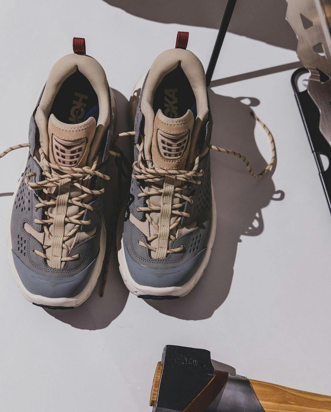 Stylized photographs of BEAMS' HOKA Tor Ultra Low & Hi Fall/Winter 2023 sneaker collaborations