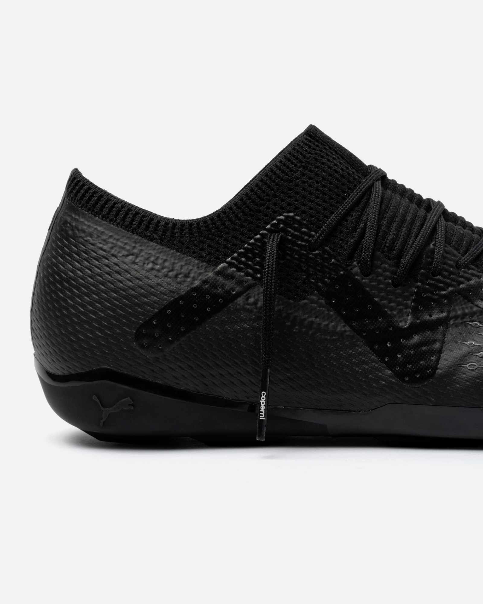 Product photos of Coperni & PUMA's collaborative sneaker in black, white and yellow colorways