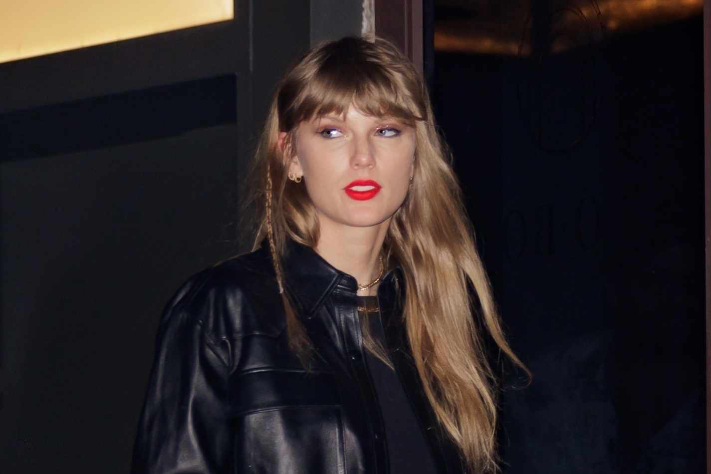 Taylor Swift wears a black leather shirt, T-shirt, denim shorts, and matching leather boots on October 1 after watching Travis Kelce's Kansas City Chiefs football game