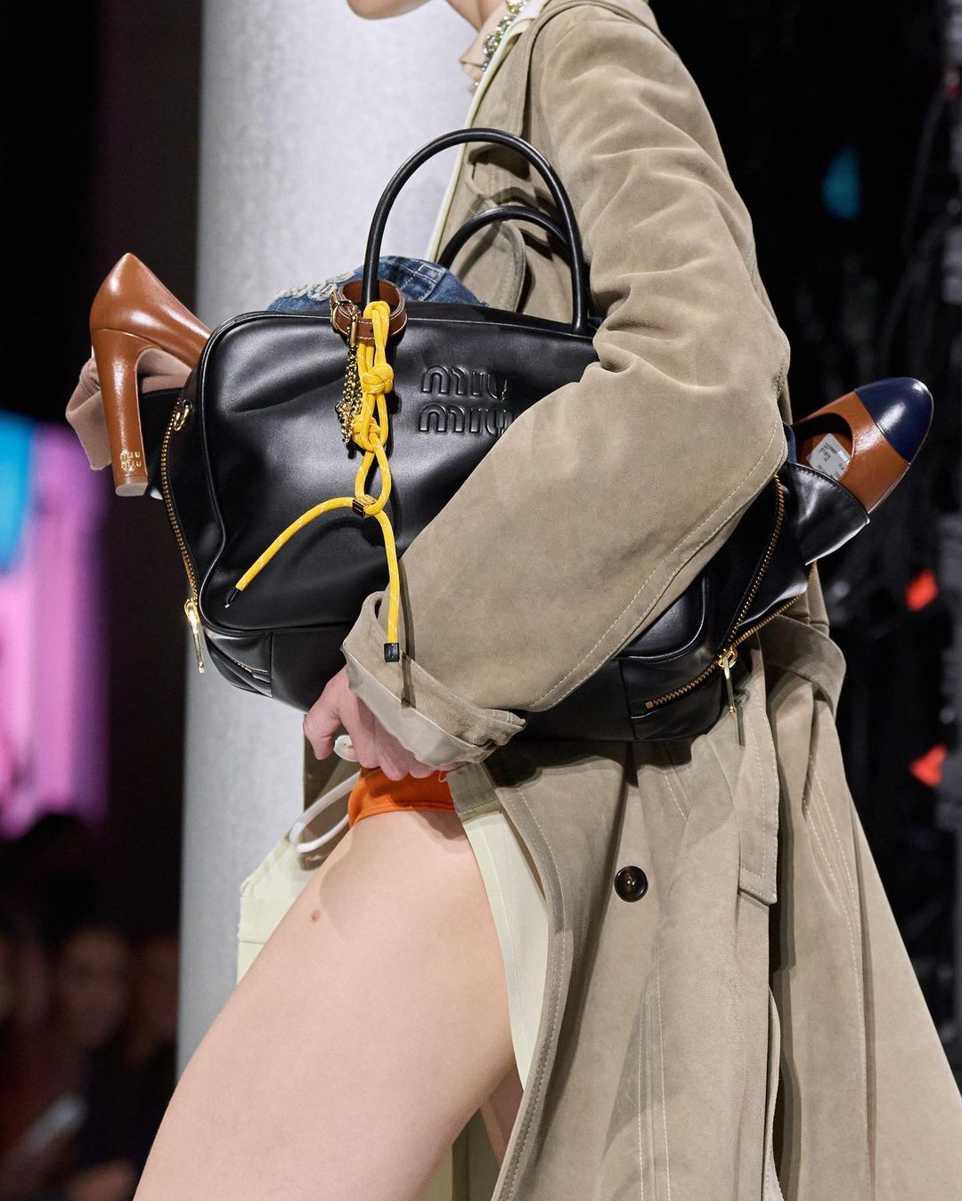 Balenciaga & Miu Miu's Overaccessorized Handbags Are Fashion
